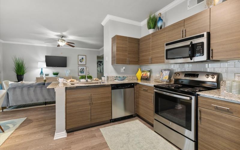a kitchen with wooden cabinets