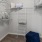 a large walk-in closet with ample shelving