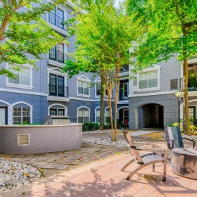 Quick access to state-of-the-art amenities a courtyard with tables and chairs
