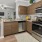 a kitchen with wooden cabinets