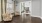 a room with a table chairs and a mirror