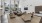 a room with a bed and chairs