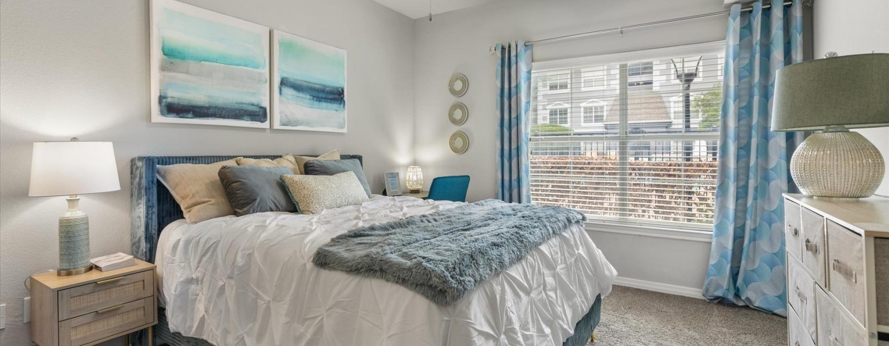 a bedroom with a fan and a bed