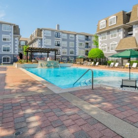 Relax and unwind poolside a swimming pool in a courtyard