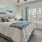 a bedroom with a fan and a bed