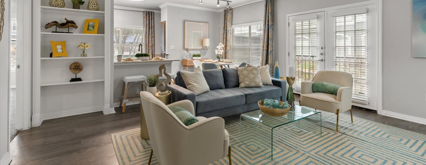 a living room with a fan and a couch