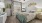 a bedroom with a bed and a fan