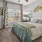 a bedroom with a bed and a fan