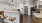 a kitchen with a bar and stools